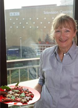 Cathy showing off the cookies she decorated for the BBC World Service Cooking for Dogs live segment